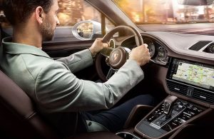 man driving 2020 Porsche Cayenne