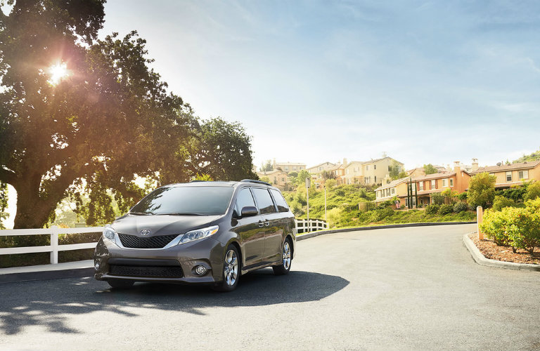 A 2016 Toyota Sienna on a smooth road