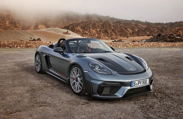 A 2024 Porsche 718 Spyder on a smooth road