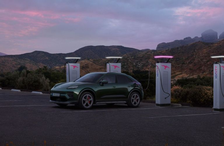 A 2025 Porsche Macan EV at a charging station