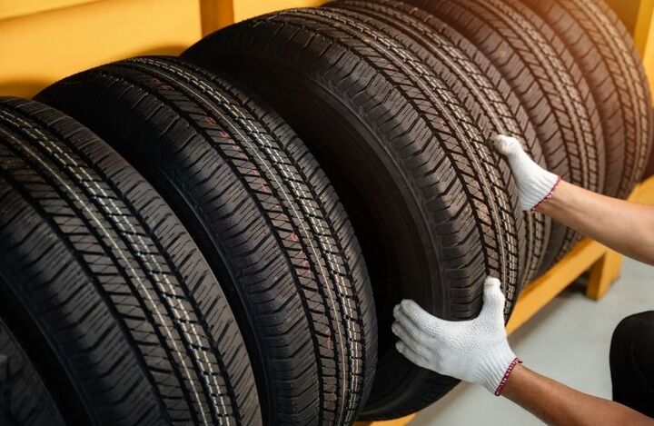 Mechanic picking up the tire